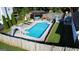 Backyard featuring a sparkling pool with a slide and a covered patio for entertaining friends and Gathering at 401 N Lost Lake Cv, Villa Rica, GA 30180