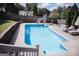 Sparkling in-ground pool with a slide, lounge chairs, and concrete surround, perfect for hot summer days at 401 N Lost Lake Cv, Villa Rica, GA 30180