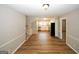 Open-concept dining area leading to the kitchen with stainless steel appliances and sleek design, ideal for entertaining at 500 Carillon Ct, Stone Mountain, GA 30083