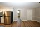 Open-concept kitchen and dining area with stainless steel appliances and modern finishes, perfect for Gathering meals at 500 Carillon Ct, Stone Mountain, GA 30083