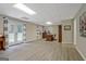 Large finished basement with outdoor access, plank flooring, and a drop ceiling at 145 Driftwood Trl, Fayetteville, GA 30215