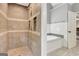 The bathroom features a tiled shower and a separate soaking tub, ideal for relaxation at 145 Driftwood Trl, Fayetteville, GA 30215