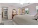 Bedroom featuring neutral walls, carpet, ceiling fan, dresser, and windows at 145 Driftwood Trl, Fayetteville, GA 30215