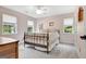 Comfortable bedroom with carpet, ceiling fan, and two windows providing natural light at 145 Driftwood Trl, Fayetteville, GA 30215