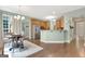 Inviting dining room area featuring hardwood floors, lots of light, and a view of the kitchen at 145 Driftwood Trl, Fayetteville, GA 30215