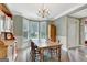 Inviting dining area with hardwood floors, large windows, and stylish furnishings for comfortable entertaining at 145 Driftwood Trl, Fayetteville, GA 30215
