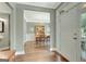 Elegant foyer with hardwood floors leads to a dining area with chandelier and ample natural light at 145 Driftwood Trl, Fayetteville, GA 30215