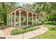 Open gazebo with picnic tables and grill, perfect for outdoor gatherings and enjoying the natural surroundings at 145 Driftwood Trl, Fayetteville, GA 30215