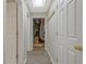 Hallway of home with multiple doors that lead to different rooms and storage spaces at 145 Driftwood Trl, Fayetteville, GA 30215