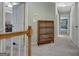 Upstairs hallway with a bookcase on the left and views to bedrooms at 145 Driftwood Trl, Fayetteville, GA 30215