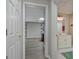 View from hallway of the basement and bathroom featuring wood-look floors at 145 Driftwood Trl, Fayetteville, GA 30215
