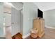 Hallway featuring the home's front door and wood flooring at 145 Driftwood Trl, Fayetteville, GA 30215
