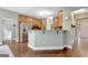 Kitchen featuring wood cabinets, stainless steel appliances, and a bar counter at 145 Driftwood Trl, Fayetteville, GA 30215