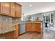 The kitchen features granite countertops, a stainless steel dishwasher, and hardwood floors at 145 Driftwood Trl, Fayetteville, GA 30215