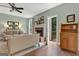 Bright living room with fireplace, wood floors, and easy access to the outdoors at 145 Driftwood Trl, Fayetteville, GA 30215