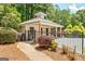 Pool house with a gated entrance and landscaping, offering convenience and style at 145 Driftwood Trl, Fayetteville, GA 30215
