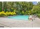 Community pool with lounge chairs on the deck, perfect for relaxing and soaking up the sun at 145 Driftwood Trl, Fayetteville, GA 30215