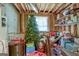 Unfinished basement area with a Christmas tree and personal belongings being stored at 145 Driftwood Trl, Fayetteville, GA 30215