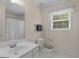 Bright bathroom features a shower-tub combo and a neutral color scheme at 416 River Forest Dr, Mcdonough, GA 30252