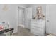 Bright bedroom with a white dresser, a play kitchen, and cozy vibes at 416 River Forest Dr, Mcdonough, GA 30252