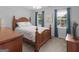 Inviting bedroom showcasing natural light, hardwood furniture, and a serene, comfortable setting at 416 River Forest Dr, Mcdonough, GA 30252