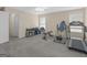 Large bonus room provides ample space for gym equipment and a desk area at 416 River Forest Dr, Mcdonough, GA 30252