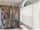 Well-organized walk-in closet with shelving and storage, providing ample space for clothing and accessories at 416 River Forest Dr, Mcdonough, GA 30252