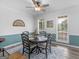 Dining room featuring a decorative light fixture, chair rail, and two windows at 416 River Forest Dr, Mcdonough, GA 30252