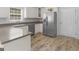 Updated kitchen with stainless steel appliances, white cabinets, and sleek countertops. This area is bright and inviting at 416 River Forest Dr, Mcdonough, GA 30252