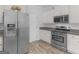 Well-equipped kitchen with stainless steel appliances, white cabinetry, and modern features at 416 River Forest Dr, Mcdonough, GA 30252