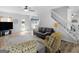 Bright living room with neutral walls, wood floors, and comfortable seating arrangement and plenty of natural light at 416 River Forest Dr, Mcdonough, GA 30252