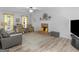 Comfortable living room showcasing a fireplace, modern furniture, and plenty of space for relaxation at 416 River Forest Dr, Mcdonough, GA 30252