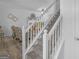 Carpeted staircase with white railing leads to the main living area at 416 River Forest Dr, Mcdonough, GA 30252