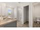 Main bathroom showcasing a dual sink vanity, soaker tub, shower, and closet at 631 Whitman Ln, Stockbridge, GA 30281