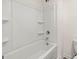 Clean bathroom with white tiled shower, a tub, and white trim at 631 Whitman Ln, Stockbridge, GA 30281