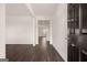 Inviting entryway with dark wood floors, white walls, and a view into the home at 631 Whitman Ln, Stockbridge, GA 30281
