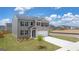 New construction two-story home with brick, dark shutters, and a well-manicured lawn at 631 Whitman Ln, Stockbridge, GA 30281