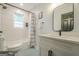Stylish bathroom features a tub shower and modern vanity with black hardware at 3833 Bakers Ferry Sw Rd, Atlanta, GA 30331