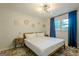 Serene bedroom featuring a large window, modern lighting, and wood accents at 3833 Bakers Ferry Sw Rd, Atlanta, GA 30331