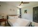 Light-filled bedroom featuring modern decor, with an adjacent dark colored door at 3833 Bakers Ferry Sw Rd, Atlanta, GA 30331