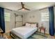 Cozy bedroom with ceiling fan and colorful area rug at 3833 Bakers Ferry Sw Rd, Atlanta, GA 30331