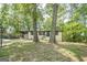 Charming single-story home featuring a blue front door, painted brick, and a driveway at 3833 Bakers Ferry Sw Rd, Atlanta, GA 30331