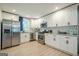 Bright kitchen featuring white cabinets, stainless steel appliances, and granite countertops at 3833 Bakers Ferry Sw Rd, Atlanta, GA 30331