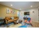 Inviting living room with stylish furniture, wood floors, and a mustard accent wall at 3833 Bakers Ferry Sw Rd, Atlanta, GA 30331