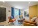 Inviting living room with stylish furniture, wood floors, a dark door and large window at 3833 Bakers Ferry Sw Rd, Atlanta, GA 30331
