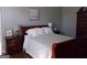 Inviting bedroom with hardwood floors, neutral walls, and a comfortable bed, creating a peaceful retreat at 216 Lake Tanisha Dr, Dallas, GA 30157