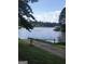 Picturesque lake view showcasing the community boat launch and beautiful water features at 216 Lake Tanisha Dr, Dallas, GA 30157