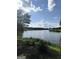 Beautiful lake view showing a bench, lush greenery, and peaceful waterfront setting at 216 Lake Tanisha Dr, Dallas, GA 30157