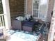 Cozy outdoor porch featuring comfortable seating and stylish decor, ideal for relaxation at 216 Lake Tanisha Dr, Dallas, GA 30157