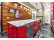 Kitchen showcases bright red cabinets, a marble countertop island, and modern appliances at 692 Kirkwood Se Ave # A, Atlanta, GA 30316